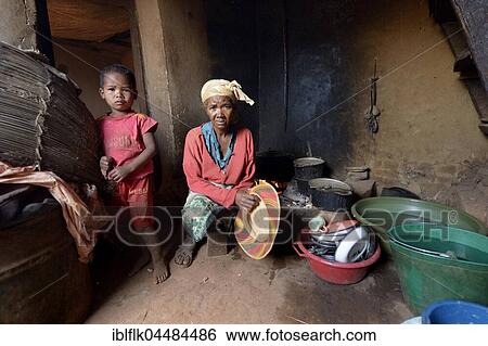 Woman and boy in kitchen, Analakely village, Tanambao commune, Tsiroanomandidy district, Bongolava region, Madagascar, Africa View Large Photo Image Stock Photograph - Woman and boy in kitchen, Analakely village, Tanambao commune, Tsiroanomandidy district, Bongolava region, Madagascar, Africa. Fotosearch