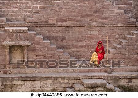 Woman in colorful sari resting on the steps at Toorji Ka Jhalara, The Step Well, Jodhphur, Rajasthan, India, Asia View Large Photo Image Stock Photography - Woman in colorful sari resting on the steps at Toorji Ka Jhalara, The Step Well, Jodhphur, Rajasthan, India, Asia. Fotosearch