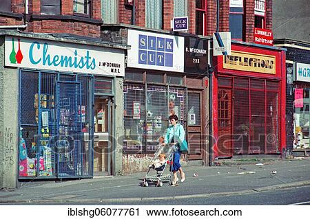 Woman with pram in front of barred shops, Falls Road district, historic photograph, 08. 09. 1986, Belfast, Northern Ireland View Large Photo Image Stock Image - Woman with pram in front of barred shops, Falls Road district, historic photograph, 08. 09. 1986, Belfast, Northern Ireland. Fotosearch