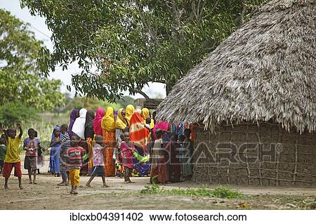 Women and children in colourful clothing next to mud hut, Orma ethnic community, Marafa, Tana River Delta, Kenya, Africa View Large Photo Image Stock Image - Women and children in colourful clothing next to mud hut, Orma ethnic community, Marafa, Tana River Delta, Kenya, Africa. Fotosearch