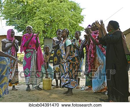 Women in colorful clothing celebrating in the village, ethnic group of Pokomo, Pokomo settlement Mbelezoni, Tana River Delta, Kenya, Africa View Large Photo Image Stock Image - Women in colorful clothing celebrating in the village, ethnic group of Pokomo, Pokomo settlement Mbelezoni, Tana River Delta, Kenya, Africa. Fotosearch