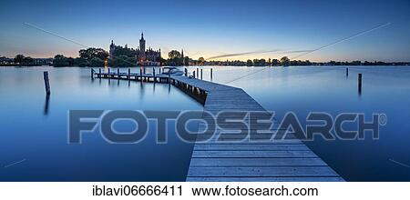 Wooden footbridge at Schwerin Lake at dusk, Schwerin Castle behind, Schwerin, Mecklenburg-Western Pomerania, Germany, Europe View Large Photo Image Stock Image - Wooden footbridge at Schwerin Lake at dusk, Schwerin Castle behind, Schwerin, Mecklenburg-Western Pomerania, Germany, Europe. Fotosearch