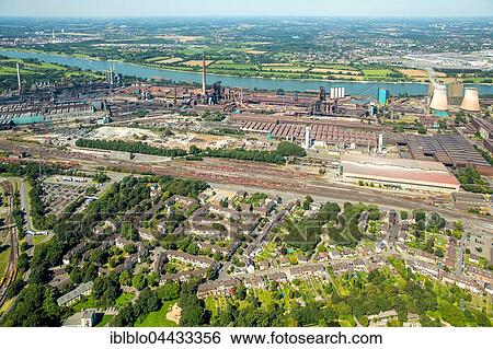 Workers' housing estate, Coking Plant and Steel Mill HKM, Hüttenheim on the Rhine, Duisburg, Ruhr district, North Rhine-Westphalia View Large Photo Image Stock Photograph - Workers' housing estate, Coking Plant and Steel Mill HKM, Hüttenheim on the Rhine, Duisburg, Ruhr district, North Rhine-Westphalia. Fotosearch