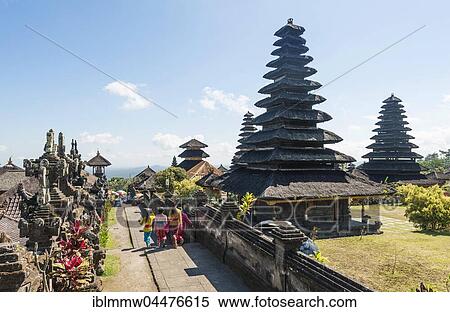 Stock Photography - Young Balinese women, mother temple, Besakih Temple pagoda, Pura Agung Besakih Penetaran, Bali-Hinduism, Banjar Besakih, Bali, Indonesia, Asia. Fotosearch