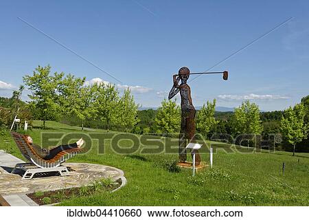 Young girl relaxing, The Golfer Sculpture, Josef Eder, Golf Lafnitztal Stegersbach, Burgenland, Austria, Europe View Large Photo Image Stock Image - Young girl relaxing, The Golfer Sculpture, Josef Eder, Golf Lafnitztal Stegersbach, Burgenland, Austria, Europe. Fotosearch