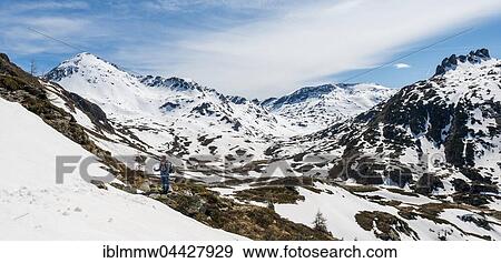 Young woman, hiker walking in mountain landscape with residual snow, Rohrmoos Obertal, Schladming Tauern, Schladming, Styria, Austria, Europe View Large Photo Image Stock Photo - Young woman, hiker walking in mountain landscape with residual snow, Rohrmoos Obertal, Schladming Tauern, Schladming, Styria, Austria, Europe. Fotosearch