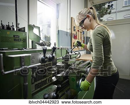 Young woman working on lathe, Metalwork, training View Large Photo Image Stock Image - Young woman working on lathe, Metalwork, training. Fotosearch
