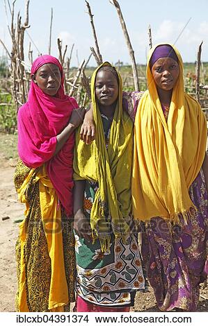 Young women in traditional dress, Orma settlement, Marafa, Tana River Delta, Kenya, Africa View Large Photo Image Picture - Young women in traditional dress, Orma settlement, Marafa, Tana River Delta, Kenya, Africa. Fotosearch