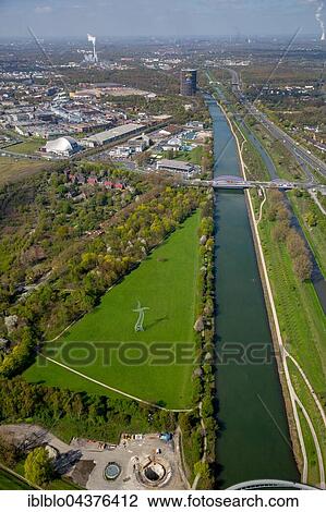 Stock Image - Zauberlehrling Sculpture, 2013 installation, dancing electric pylon, Emscher art, Ines Idee art group, Oberhausen, Ruhr district, North Rhine-Westphalia, Germany, Europe. Fotosearch