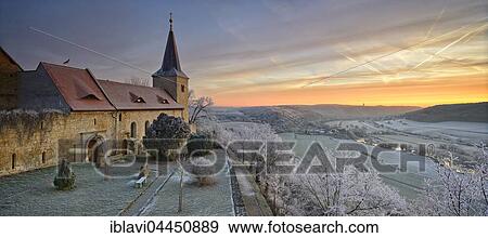 Stock Photo - Zscheiplitz Abbey covered in hoarfrost at sunrise, with view of the Unstrut Valley, winter, Freyburg, Saxony-Anhalt, Germany, Europe. Fotosearch