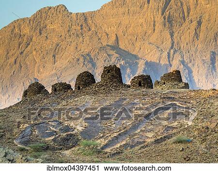 5000 year old beehive tombs, archaeological site of Al-Ayn, UNESCO World Heritage Site, Jebel Misht mountain chain, Hajar al Gharbi, Hajjar Mountains, Al Dhahirah Region, Oman, Asia View Large Photo Image Stock Image - 5000 year old beehive tombs, archaeological site of Al-Ayn, UNESCO World Heritage Site, Jebel Misht mountain chain, Hajar al Gharbi, Hajjar Mountains, Al Dhahirah Region, Oman, Asia. Fotosearch