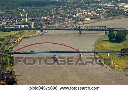Aerial view, Cargo ship on the Rhine during flood, the bridge of solidarity, Brücke der Solidarität, IWT, Duisburg, Ruhr district, North Rhine-Westphalia, Germany, Europe View Large Photo Image Stock Photograph - Aerial view, Cargo ship on the Rhine during flood, the bridge of solidarity, Brücke der Solidarität, IWT, Duisburg, Ruhr district, North Rhine-Westphalia, Germany, Europe. Fotosearch
