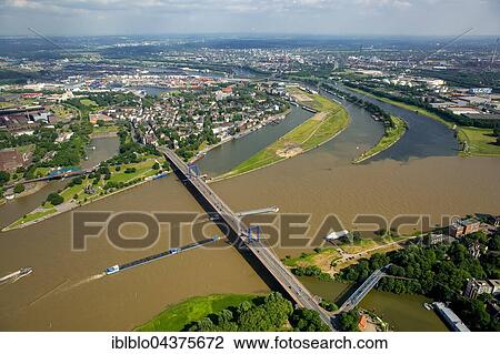 Aerial view, Cargo ships on the Rhine, brown flood mixes with the clean water of the Ruhr, Ruhr estuary, Duisburg, Ruhr district, North Rhine-Westphalia, Germany, Europe View Large Photo Image Stock Image - Aerial view, Cargo ships on the Rhine, brown flood mixes with the clean water of the Ruhr, Ruhr estuary, Duisburg, Ruhr district, North Rhine-Westphalia, Germany, Europe. Fotosearch
