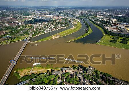 Aerial view, Cargo ships on the Rhine, brown flood mixes with the clean water of the Ruhr, Ruhr estuary, Duisburg, Ruhr district, North Rhine-Westphalia, Germany, Europe View Large Photo Image Stock Photo - Aerial view, Cargo ships on the Rhine, brown flood mixes with the clean water of the Ruhr, Ruhr estuary, Duisburg, Ruhr district, North Rhine-Westphalia, Germany, Europe. Fotosearch