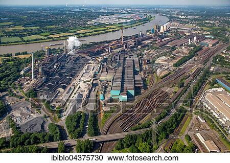 Stock Image - Aerial view, coking plant and steel plant HKM in Hüttenheim district on the Rhine with floods, Duisburg, Ruhr district, North Rhine-Westphalia, Germany, Europe. Fotosearch