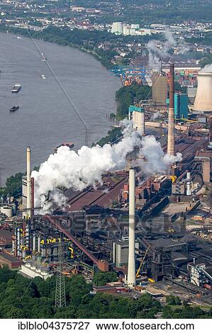 Aerial view, coking plant and steel plant HKM in Hüttenheim district on the Rhine with floods, Duisburg, Ruhr district, North Rhine-Westphalia, Germany, Europe View Large Photo Image Stock Photo - Aerial view, coking plant and steel plant HKM in Hüttenheim district on the Rhine with floods, Duisburg, Ruhr district, North Rhine-Westphalia, Germany, Europe. Fotosearch