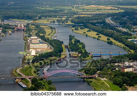 Aerial view, lock, Ruhr sluice and harbor channel Duisburg, Oberbürgermeister-Lehr-Brücke, Ruhr district, Duisburg, Ruhr district, North Rhine-Westphalia, Germany, Europe View Large Photo Image Stock Photo - Aerial view, lock, Ruhr sluice and harbor channel Duisburg, Oberbürgermeister-Lehr-Brücke, Ruhr district, Duisburg, Ruhr district, North Rhine-Westphalia, Germany, Europe. Fotosearch