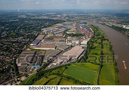 Stock Image - Aerial view, Logport 1 and Logport II in Rheinhausen am Rhein with Container Terminal and Rhine flood, Duisburg, Ruhr district, North Rhine-Westphalia, Germany, Europe. Fotosearch