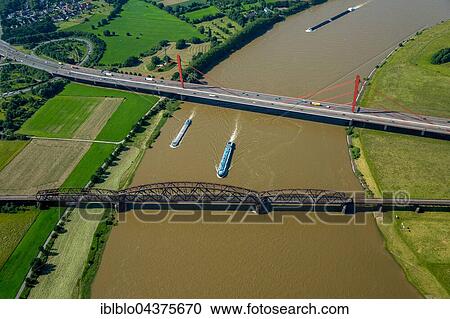 Aerial view, Rheinbogen, cargo ships, Rhine between Duisburg Baerl and Beeckerwerth, Flood, Railway Bridge, A42 motorway bridge, Duisburg, Ruhr district, North Rhine-Westphalia, Germany, Europe View Large Photo Image Stock Image - Aerial view, Rheinbogen, cargo ships, Rhine between Duisburg Baerl and Beeckerwerth, Flood, Railway Bridge, A42 motorway bridge, Duisburg, Ruhr district, North Rhine-Westphalia, Germany, Europe. Fotosearch