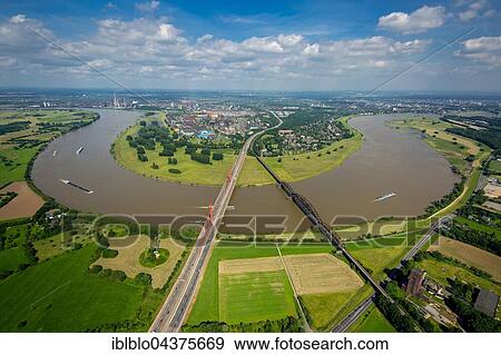 Aerial view, Rheinbogen, cargo ships, Rhine between Duisburg Baerl and Beeckerwerth, Flood, Railway Bridge, A42 motorway bridge, Duisburg, Ruhr district, North Rhine-Westphalia, Germany, Europe View Large Photo Image Stock Photo - Aerial view, Rheinbogen, cargo ships, Rhine between Duisburg Baerl and Beeckerwerth, Flood, Railway Bridge, A42 motorway bridge, Duisburg, Ruhr district, North Rhine-Westphalia, Germany, Europe. Fotosearch