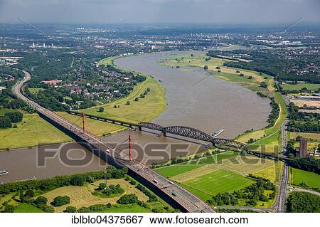 Aerial view, Rheinbogen, Rhine between Duisburg Baerl and Beeckerwerth, Flood, Railway Bridge, A42 motorway bridge, Duisburg, Ruhr district, North Rhine-Westphalia, Germany, Europe View Large Photo Image Stock Photo - Aerial view, Rheinbogen, Rhine between Duisburg Baerl and Beeckerwerth, Flood, Railway Bridge, A42 motorway bridge, Duisburg, Ruhr district, North Rhine-Westphalia, Germany, Europe. Fotosearch