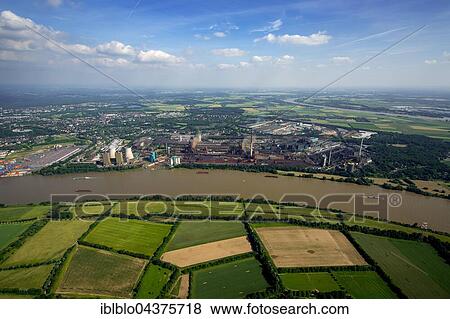 Aerial view, steelworks HKM the district Hüttenheim am Rhein with floods, Duisburg, Ruhr district, North Rhine-Westphalia, Germany, Europe View Large Photo Image Stock Photo - Aerial view, steelworks HKM the district Hüttenheim am Rhein with floods, Duisburg, Ruhr district, North Rhine-Westphalia, Germany, Europe. Fotosearch