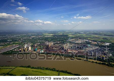 Aerial view, steelworks HKM the district Hüttenheim am Rhein with floods, Duisburg, Ruhr district, North Rhine-Westphalia, Germany, Europe View Large Photo Image Stock Photo - Aerial view, steelworks HKM the district Hüttenheim am Rhein with floods, Duisburg, Ruhr district, North Rhine-Westphalia, Germany, Europe. Fotosearch