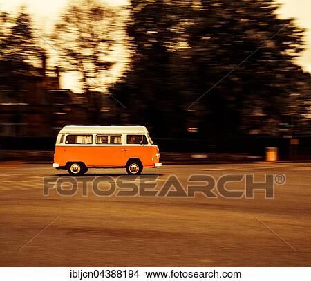 Picture - Age VW bus, VW T2, Volkswagen, driving, evening, Edinburgh, Scotland, United Kingdom, Europe. Fotosearch