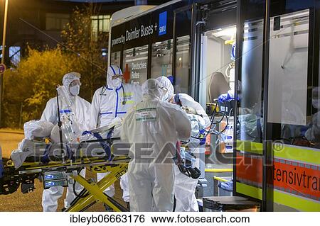 Stock Photograph - Ambulance, large capacity intensive care transport vehicle with Covid-19 patients, Germany, Europe. Fotosearch
