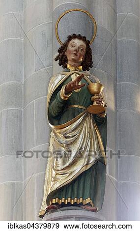 Apostle John, larger than life wooden statue of 1552, minster St. Nikolaus, Überlingen, Lake Constance, Baden-Württemberg, Germany, Europe View Large Photo Image Stock Photo - Apostle John, larger than life wooden statue of 1552, minster St. Nikolaus, Überlingen, Lake Constance, Baden-Württemberg, Germany, Europe. Fotosearch