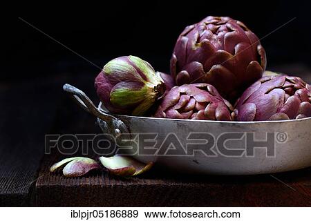 Stock Photo - Artichokes ( Cynara scolymus) in a bowl. Fotosearch