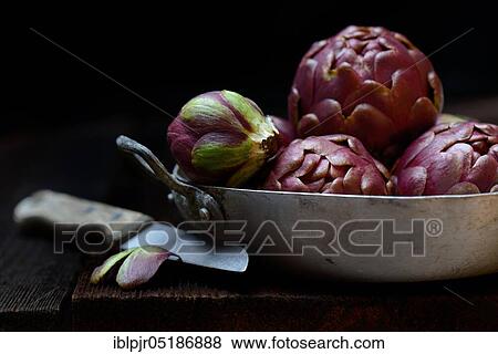 Artichokes ( Cynara scolymus) in bowl and kitchen knife View Large Photo Image Stock Photo - Artichokes ( Cynara scolymus) in bowl and kitchen knife. Fotosearch