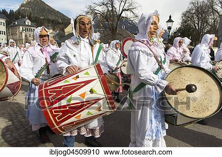 Aussee Carnival, men with masks and drums, white robes, Trommelweiber, Bad Aussee, Styria, Austria, Europe View Large Photo Image Stock Image - Aussee Carnival, men with masks and drums, white robes, Trommelweiber, Bad Aussee, Styria, Austria, Europe. Fotosearch