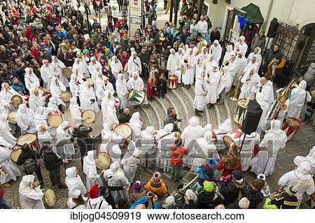Aussee Carnival, men with masks and drums, white robes, Trommelweiber, ceremony for admission to Trommelweib, Bad Aussee, Styria, Austria, Europe View Large Photo Image Stock Photo - Aussee Carnival, men with masks and drums, white robes, Trommelweiber, ceremony for admission to Trommelweib, Bad Aussee, Styria, Austria, Europe. Fotosearch