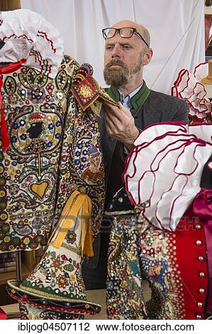 Ausseer Flinserl, man checking costume with ruff in workshop, sequins, different appliqué motives, Bad Aussee, Styria, Austria, Europe View Large Photo Image Stock Image - Ausseer Flinserl, man checking costume with ruff in workshop, sequins, different appliqué motives, Bad Aussee, Styria, Austria, Europe. Fotosearch