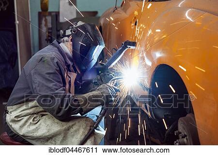 Auto Repair, coachbuilder restores a VW Karmann Ghia, welding of side part, Düsseldorf, North Rhine-Westphalia, Germany, Europe View Large Photo Image Stock Image - Auto Repair, coachbuilder restores a VW Karmann Ghia, welding of side part, Düsseldorf, North Rhine-Westphalia, Germany, Europe. Fotosearch