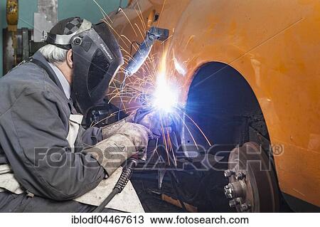 Auto Repair, coachbuilder restores a VW Karmann Ghia, welding of side part, Düsseldorf, North Rhine-Westphalia, Germany, Europe View Large Photo Image Stock Image - Auto Repair, coachbuilder restores a VW Karmann Ghia, welding of side part, Düsseldorf, North Rhine-Westphalia, Germany, Europe. Fotosearch