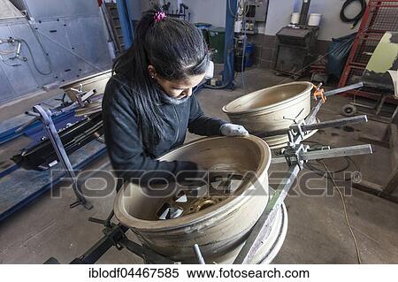 Auto Repair Shop, female coachbuilder grinding wheels, Düsseldorf, North Rhine-Westphalia, Germany, Europe View Large Photo Image Stock Photography - Auto Repair Shop, female coachbuilder grinding wheels, Düsseldorf, North Rhine-Westphalia, Germany, Europe. Fotosearch