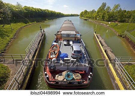 Barge travelling from the Great Schleuse Bevergern on the Dortmund-Ems Canal, Hörstel, Münsterland, North Rhine-Westphalia, Germany, Europe View Large Photo Image Picture - Barge travelling from the Great Schleuse Bevergern on the Dortmund-Ems Canal, Hörstel, Münsterland, North Rhine-Westphalia, Germany, Europe. Fotosearch