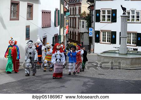 Stock Photo - Basel carnival, Gemsberg fountain, piper group at Basel Gemsberg, old town, Basel, Switzerland, Europe. Fotosearch