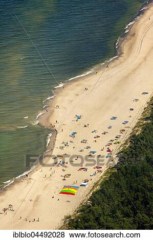 Bathers, sandy beach on the Baltic Sea, in the seaside resort Niechorze, Baltic Coast, West Pomerania Province, Poland, Europe View Large Photo Image Stock Photo - Bathers, sandy beach on the Baltic Sea, in the seaside resort Niechorze, Baltic Coast, West Pomerania Province, Poland, Europe. Fotosearch