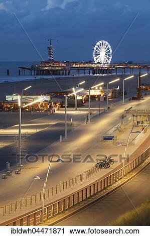 Stock Image - Beach boardwalk on the pier at night, Scheveningen, The Hague, Holland, The Netherlands, Europe. Fotosearch