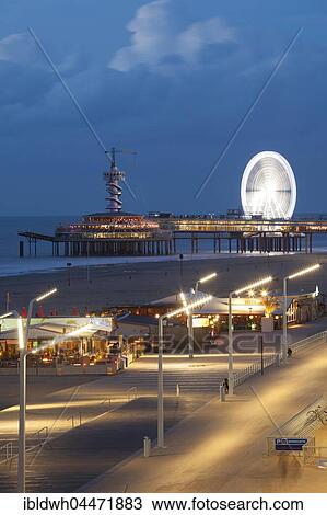 Beach boardwalk on the pier at night, Scheveningen, The Hague, Holland, The Netherlands, Europe View Large Photo Image Stock Image - Beach boardwalk on the pier at night, Scheveningen, The Hague, Holland, The Netherlands, Europe. Fotosearch