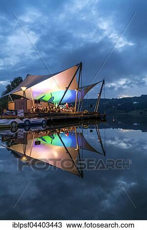 Beach concert at dusk with the band Buhl on the lake stage, Großer Alpsee Lake near Bühl, Allgäu, Bavaria, Germany, Europe View Large Photo Image Stock Image - Beach concert at dusk with the band Buhl on the lake stage, Großer Alpsee Lake near Bühl, Allgäu, Bavaria, Germany, Europe. Fotosearch