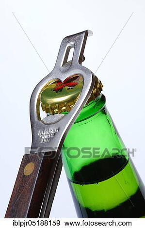 Stock Photo - Beer bottle with bottle opener. Fotosearch