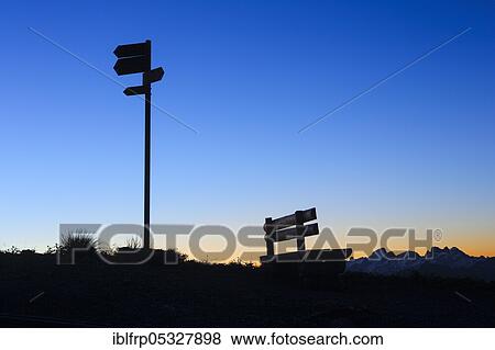 Stock Photo - Bench and signpost, Bernese Oberland, Switzerland, Europe. Fotosearch