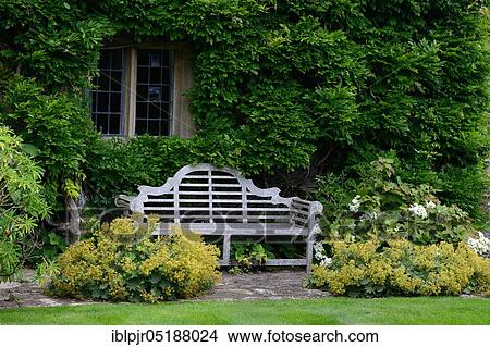 Picture - Bench in front of the house, Great Britain, England, Great Britain. Fotosearch