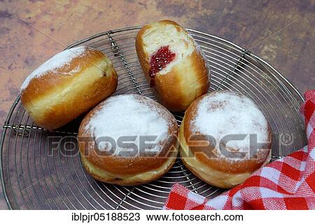 Stock Image - Berlin pancakes, bite. Fotosearch