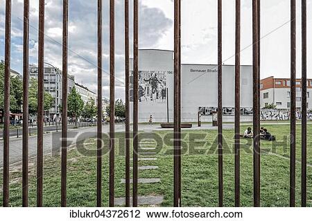Bernauer Strasse, Berlin Wall Memorial, photo of border guard leaping over barbed wire fence, taken by the photographer Peter Leibing, Berlin, Germany, Europe View Large Photo Image Stock Image - Bernauer Strasse, Berlin Wall Memorial, photo of border guard leaping over barbed wire fence, taken by the photographer Peter Leibing, Berlin, Germany, Europe. Fotosearch