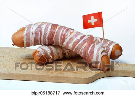 Stock Photo - Bernerli, Berner sausage, grilled sausage with bacon and cheese. Fotosearch